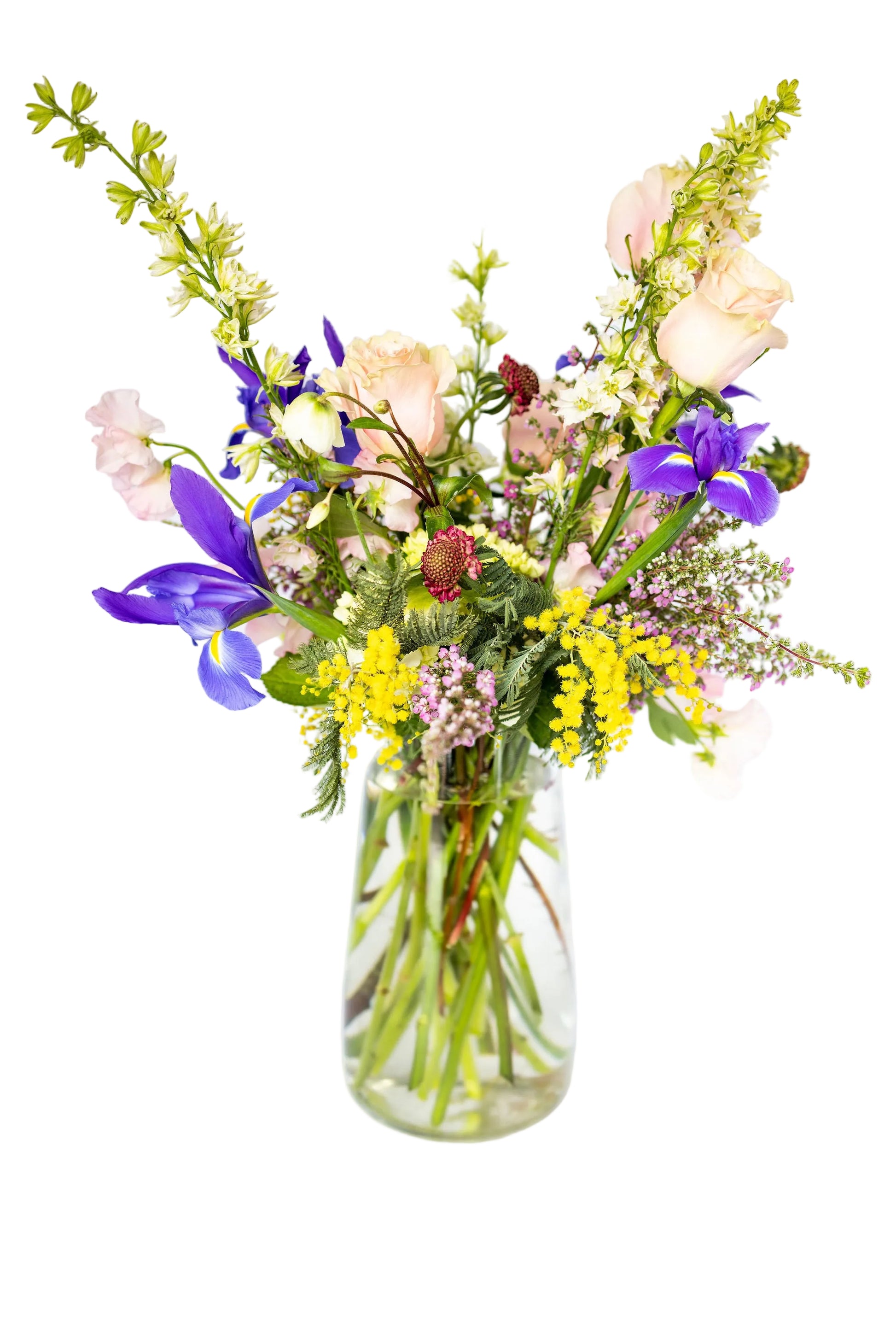 Bouquet of flowers in a clear vase on a white background